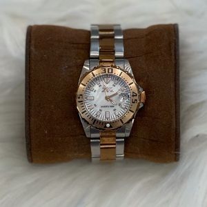 2toned Invicta watch with a pearl face